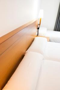 a row of beds in a room at Gran Hotel Victoria in El Ejido