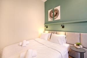Posteľ alebo postele v izbe v ubytovaní The Flirty Athens apartment