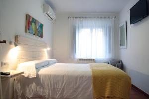 Letto o letti in una camera di Hotel 3 Arcs