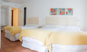 Кровать или кровати в номере Hotel 3 Arcs