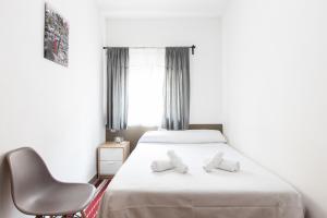 Llit o llits en una habitació de Pensión Galicia