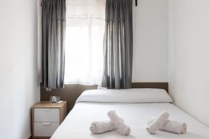 Cama o camas de una habitación en Pensión Galicia