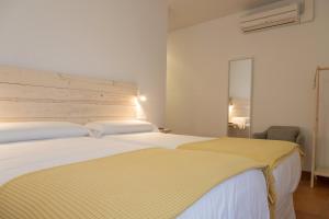 Letto o letti in una camera di Hotel 3 Arcs