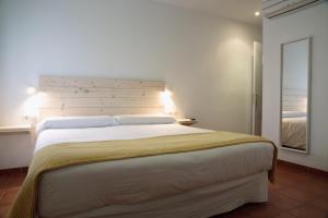 Letto o letti in una camera di Hotel 3 Arcs