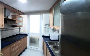 A kitchen or kitchenette at Apartamento Realengo Sevilla