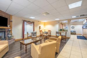 a waiting room with furniture and a fireplace at Americas Best Value Inn - Chattanooga in Chattanooga