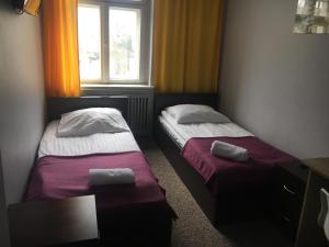 En eller flere senger på et rom på Hostel Centrum