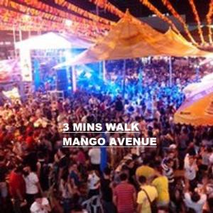 a crowd of people at a concert with the words mins walk manage rave at HORIZON 101 A4 near robinson mall Free POOL WIFI in Cebu City