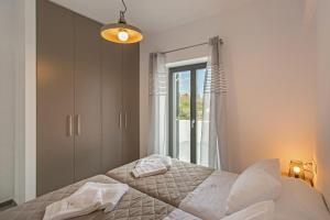 Postel nebo postele na pokoji v ubytování Vastblue of Paros