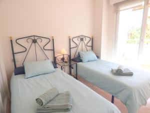 Posteľ alebo postele v izbe v ubytovaní Puerto Azul - EaW Homes