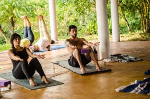 a group of people sitting on the floor in a yoga class at Los Amigos Ecoturismo y Reserva Natural in Catemaco