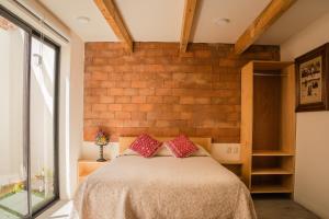 Ένα ή περισσότερα κρεβάτια σε δωμάτιο στο Mansion Primavera