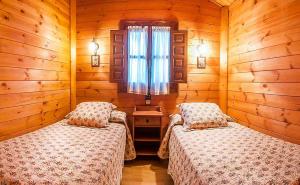Ένα ή περισσότερα κρεβάτια σε δωμάτιο στο Camping Playa de Vega