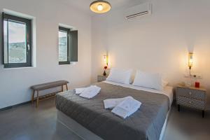 Postel nebo postele na pokoji v ubytování Vastblue of Paros