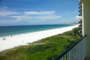 a view of the beach from the balcony of a condo at Gorgeous views that stretch forever right from your very own private balcony! in Marco Island