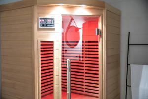 a walk in closet with a glass door at Chablis SPA : duplex Grand Cru in Chablis +5 photos