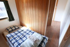 Postel nebo postele na pokoji v ubytování Guesthouse Izame Ann