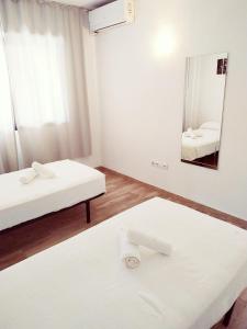 Łóżko lub łóżka w pokoju w obiekcie Apartamento Ronda 4 - Los Boliches