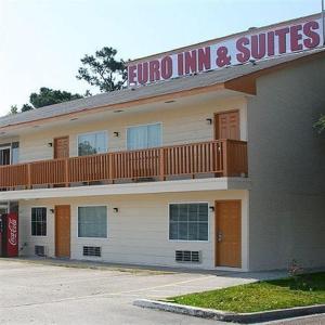 a inn and suites building with a balcony at Euro Inn & Suites of Slidell in Slidell