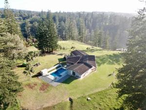 an aerial view of a house with a swimming pool at Shearwater Scenic Villas in Burnt Pine