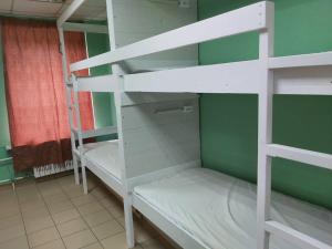 a room with two bunk beds in a room at Marseille Hostel in Saint Petersburg