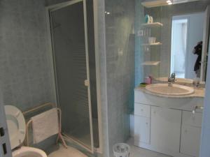 a bathroom with a shower and a sink and a toilet at Maison Margot in Vallauris +9 photos