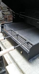 a barbecue grill sitting on top of a table at The Tinkov house in Lovech in Lovech