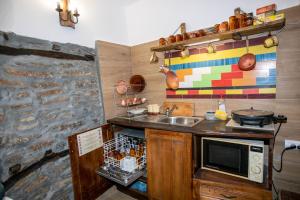 a kitchen with a sink and a microwave at The Tinkov house in Lovech in Lovech