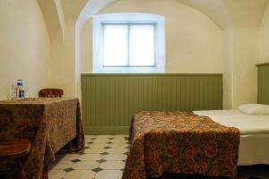 Posteľ alebo postele v izbe v ubytovaní Laitse castle