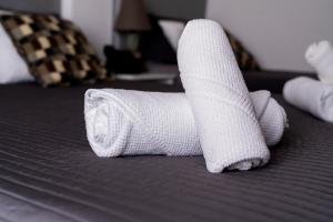 a pair of white socks on a bed at OceanOasis in Olhão