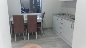 Kuchyň nebo kuchyňský kout v ubytování Apartment VILLA MERCI