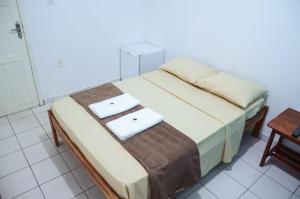 Ein Bett oder Betten in einem Zimmer der Unterkunft HOTEL XENIOS