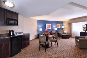 a hotel room with a kitchen and a living room at Holiday Inn Express Port Hueneme, an IHG Hotel in Port Hueneme