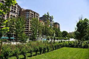 a garden with a fountain in the middle of a city at Saryan Street Studio Apartment in Yerevan