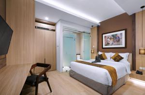 Letto o letti in una camera di S7 SUITES GANDARIA