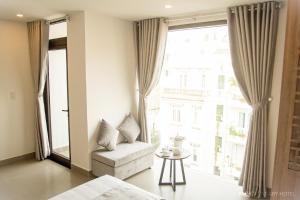 Posteľ alebo postele v izbe v ubytovaní An Hoi Canary Hotel