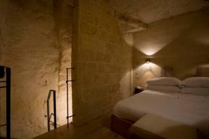Voodi või voodid majutusasutuse L'Hotel In Pietra toas