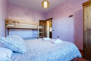 a bedroom with a bed and a bunk bed at El Castillito in Chiclana de la Frontera +41 photos