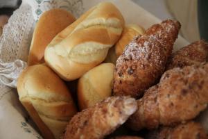 a pile of buns and other food in a bowl at Lindenhof- Fam. Forstmayr in Haag