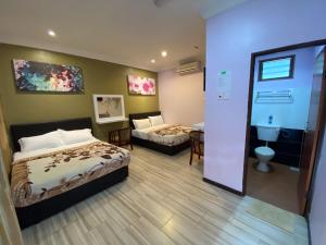 Ein Bett oder Betten in einem Zimmer der Unterkunft Redang De' Rimba