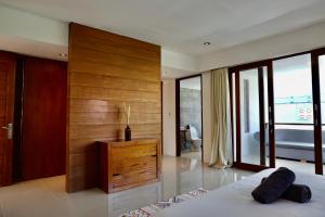 Ein Bett oder Betten in einem Zimmer der Unterkunft Casa Naima Petitenget Villa
