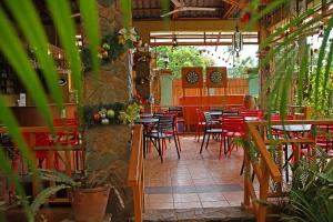a man sitting at a table in a restaurant at Darayonan Lodge in Coron