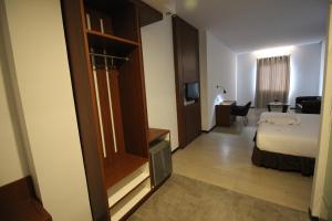Postel nebo postele na pokoji v ubytování Xtra Hotel Bengkulu