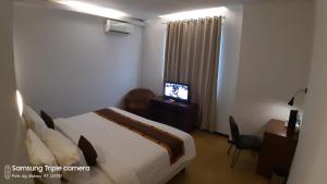 TV a/nebo společenská místnost v ubytování Xtra Hotel Bengkulu