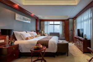 Postel nebo postele na pokoji v ubytování Changsha Sun Shine Hotel