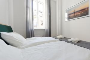 Posteľ alebo postele v izbe v ubytovaní Apartament Mickiewicza