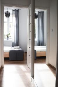 Posteľ alebo postele v izbe v ubytovaní Apartament Mickiewicza
