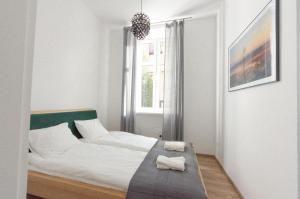 Posteľ alebo postele v izbe v ubytovaní Apartament Mickiewicza