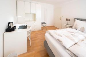 Letto o letti in una camera di Aparthome L.I.N.Z.