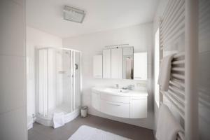 Koupelna v ubytování Aparthome L.I.N.Z. + 37 fotografií